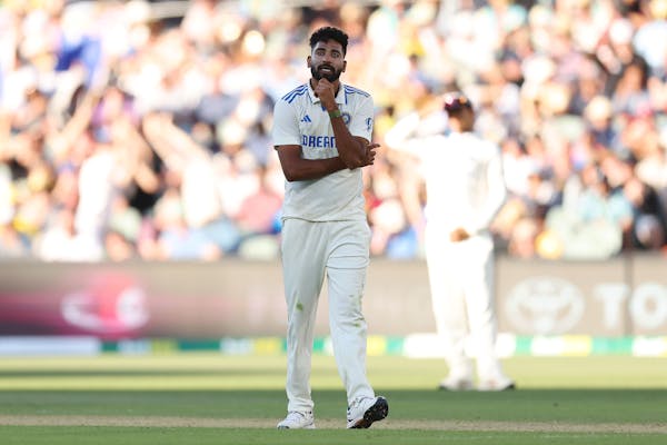 Mohammed Siraj reacts after getting hit by Steven Smith at the MCG